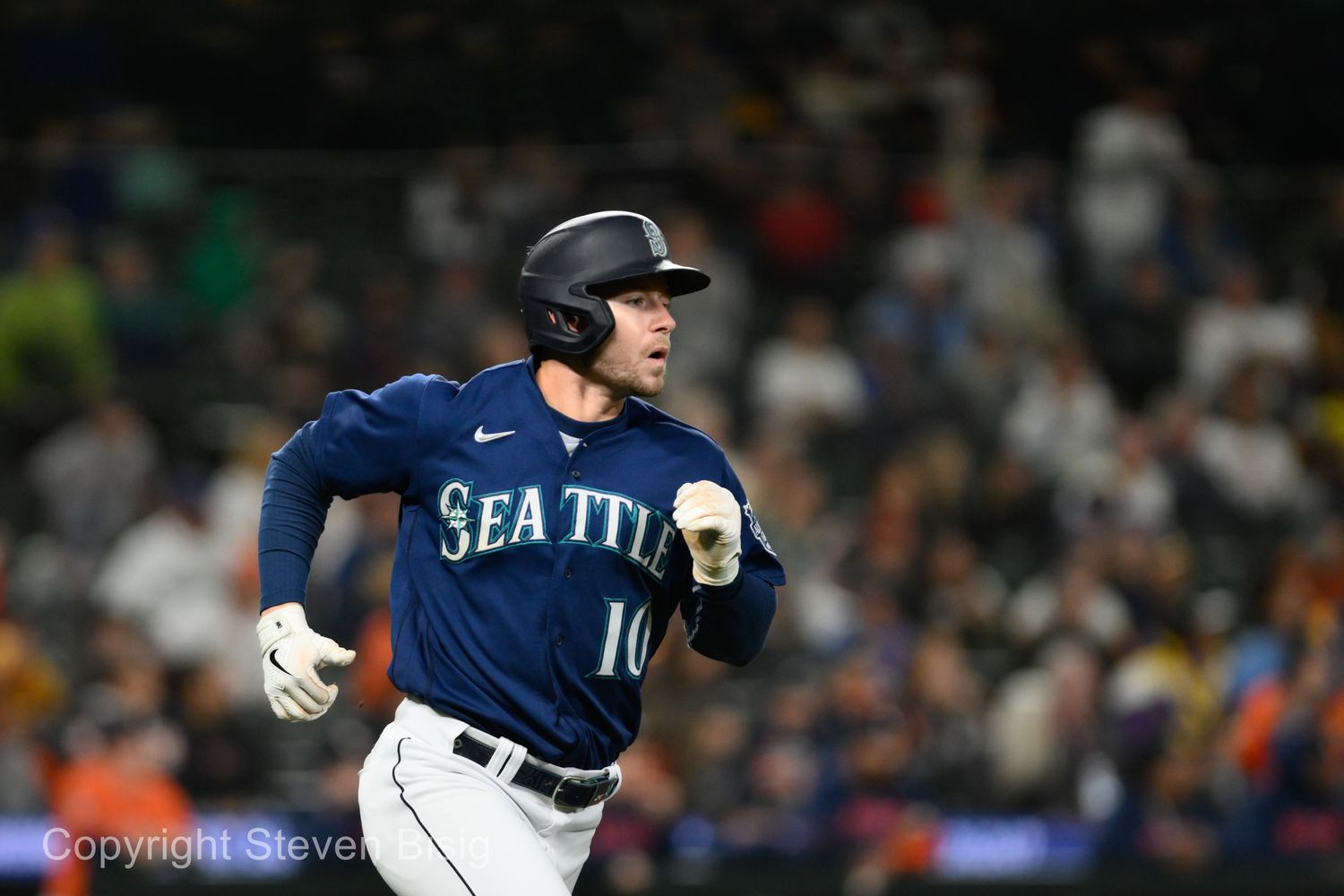 Sep 27, 2023; Seattle, Washington, USA; Seattle Mariners left fielder Jarred Kelenic (10) runs towards first base after hitting a single against the Houston Astros during the ninth inning at T-Mobile Park. Mandatory Credit: Steven Bisig-USA TODAY Sports  
